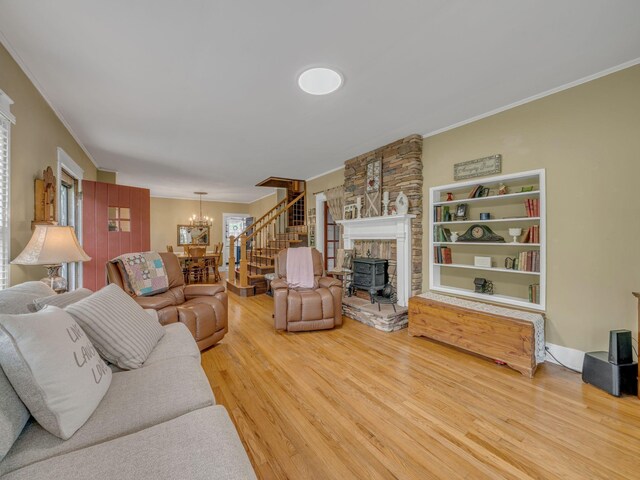609 W Main St, Waverly, TN 37185 - living room featuring an inviting chandelier, ornamental molding, stairs, and wood finished floors