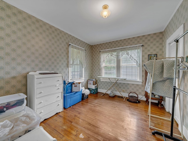 609 W Main St, Waverly, TN 37185 - interior space with wallpapered walls, ornamental molding, baseboards, and light wood finished floors