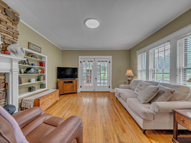 609 W Main St, Waverly, TN 37185 - living area featuring french doors, ornamental molding, and light wood-type flooring