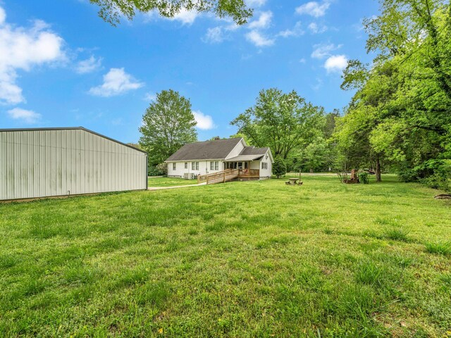 609 W Main St, Waverly, TN 37185 - view of yard with a pole building, an outbuilding, and a wooden deck