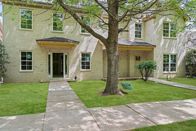 2145 Cason Ln, Murfreesboro, TN 37128 - view of front of house featuring brick siding, roof with shingles, and a front lawn