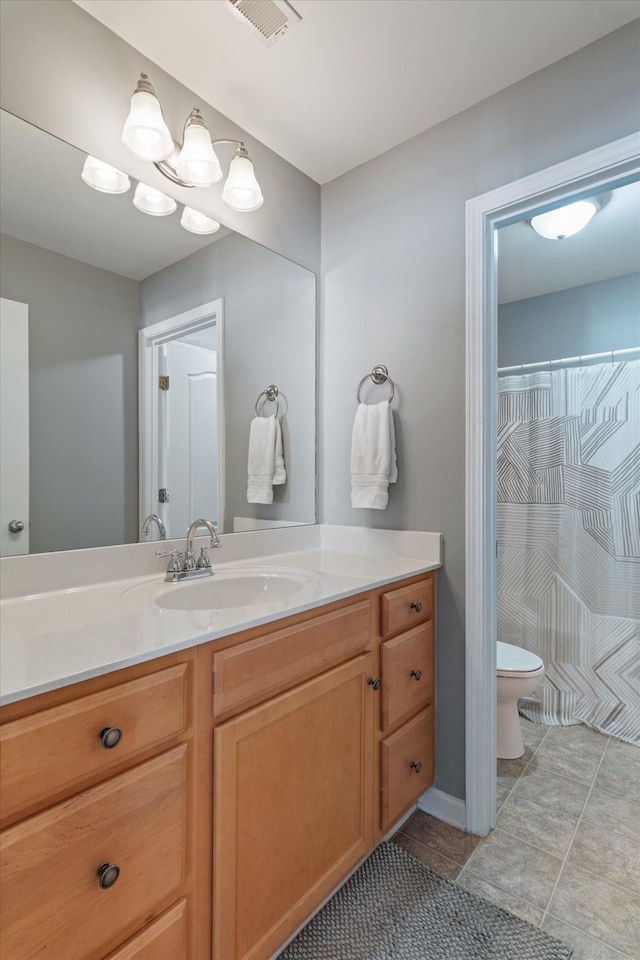 full bathroom featuring toilet, visible vents, tile patterned flooring, and vanity