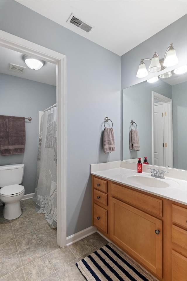 full bath featuring vanity, baseboards, toilet, and visible vents