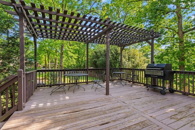 deck with area for grilling and a pergola