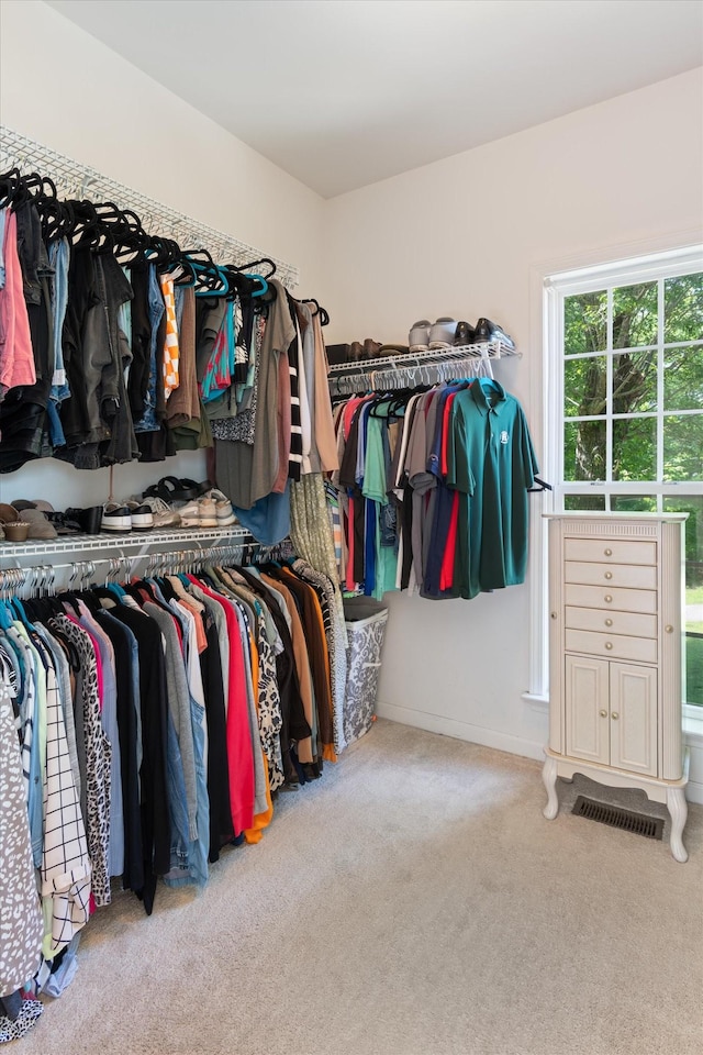 walk in closet featuring carpet floors and visible vents