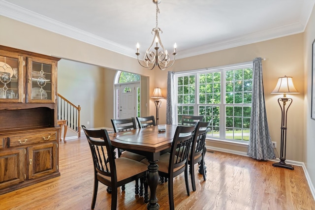 dining room featuring stairs, a chandelier, a wealth of natural light, and light wood-type flooring