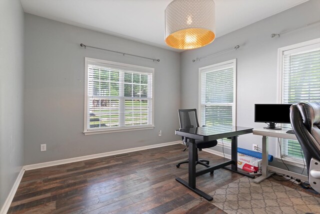 office with baseboards and hardwood / wood-style flooring