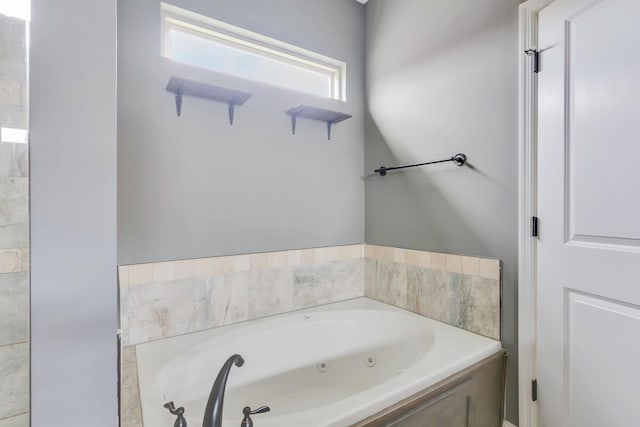 bathroom featuring a tub with jets