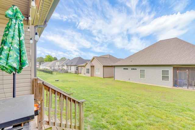 view of yard with a residential view and fence
