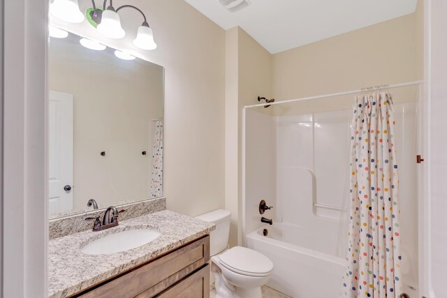 bathroom with toilet, shower / bath combo with shower curtain, and vanity