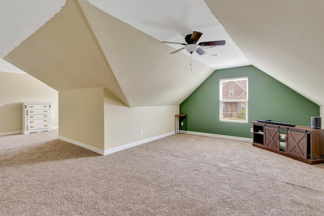 bonus room featuring carpet floors, ceiling fan, baseboards, and lofted ceiling