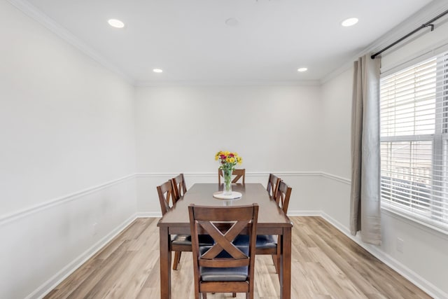 dining space with light wood-type flooring, recessed lighting, and crown molding