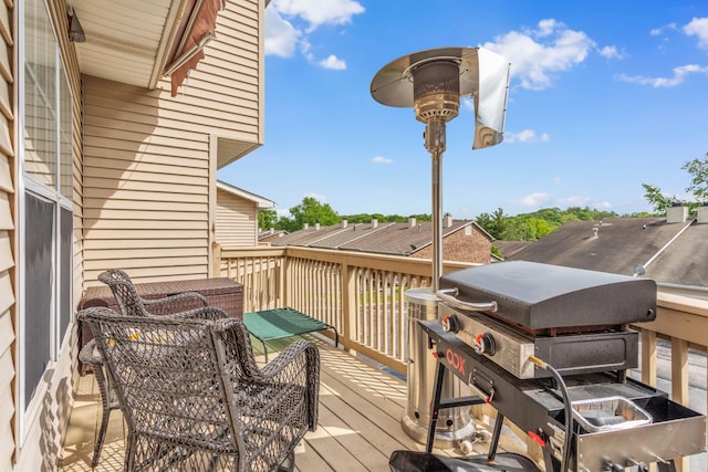 deck featuring a grill