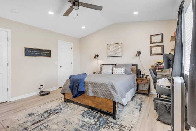 bedroom featuring baseboards, a ceiling fan, light wood finished floors, and lofted ceiling