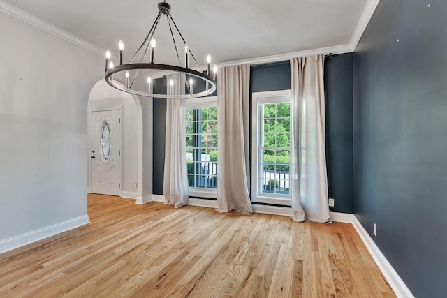 1012 Carrs Creek Blvd, Greenbrier, TN 37073 - unfurnished dining area with baseboards, a notable chandelier, ornamental molding, and wood finished floors