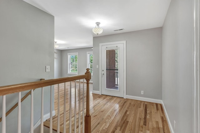 1012 Carrs Creek Blvd, Greenbrier, TN 37073 - corridor with visible vents, light wood-style flooring, baseboards, and an upstairs landing