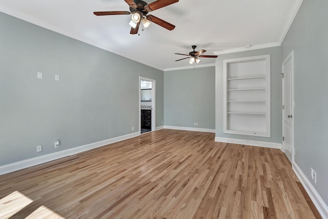 1012 Carrs Creek Blvd, Greenbrier, TN 37073 - unfurnished living room featuring ceiling fan, built in features, light wood-style flooring, baseboards, and ornamental molding