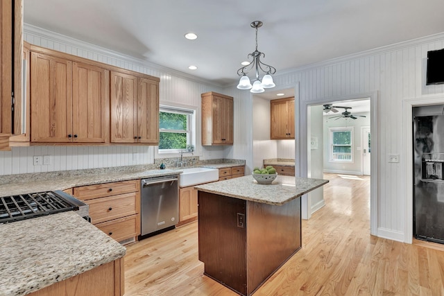 1012 Carrs Creek Blvd, Greenbrier, TN 37073 - kitchen featuring crown molding, a center island, pendant lighting, a sink, and stainless steel appliances