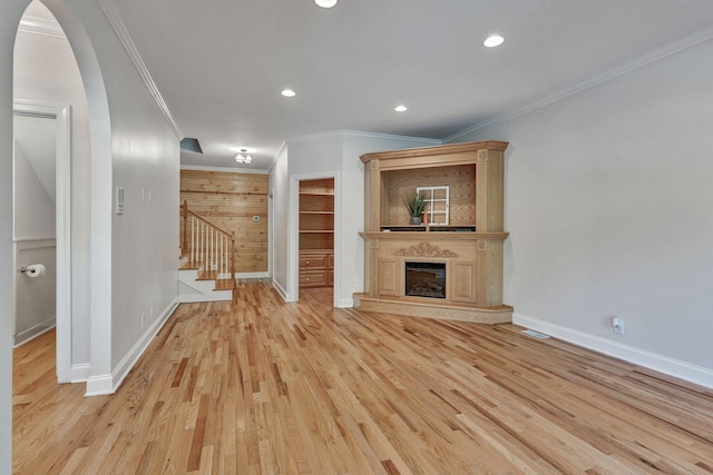 1012 Carrs Creek Blvd, Greenbrier, TN 37073 - unfurnished living room featuring stairs, baseboards, ornamental molding, and wood finished floors