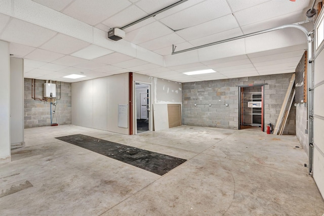 1012 Carrs Creek Blvd, Greenbrier, TN 37073 - basement featuring concrete block wall and a drop ceiling