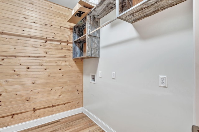 1012 Carrs Creek Blvd, Greenbrier, TN 37073 - laundry area with washer hookup, laundry area, wood walls, baseboards, and light wood finished floors