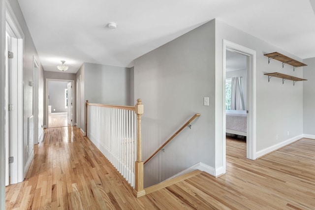 1012 Carrs Creek Blvd, Greenbrier, TN 37073 - corridor with baseboards, light wood finished floors, and an upstairs landing
