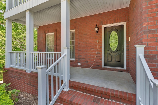 1012 Carrs Creek Blvd, Greenbrier, TN 37073 - doorway to property featuring brick siding and covered porch