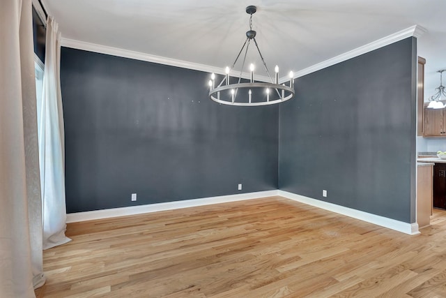 1012 Carrs Creek Blvd, Greenbrier, TN 37073 - unfurnished dining area with crown molding, baseboards, light wood finished floors, and a notable chandelier