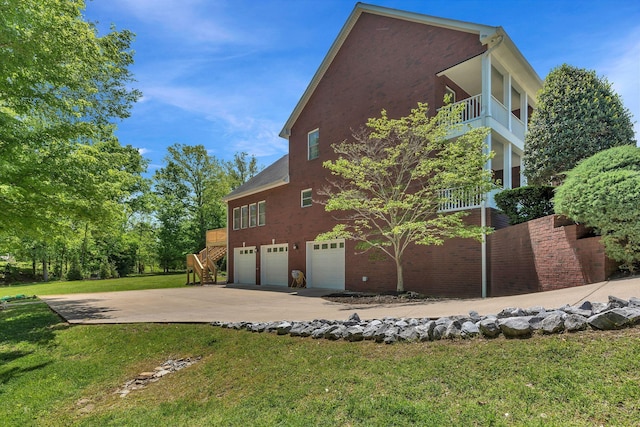 1012 Carrs Creek Blvd, Greenbrier, TN 37073 - view of home's exterior with stairs, a garage, a yard, and concrete driveway