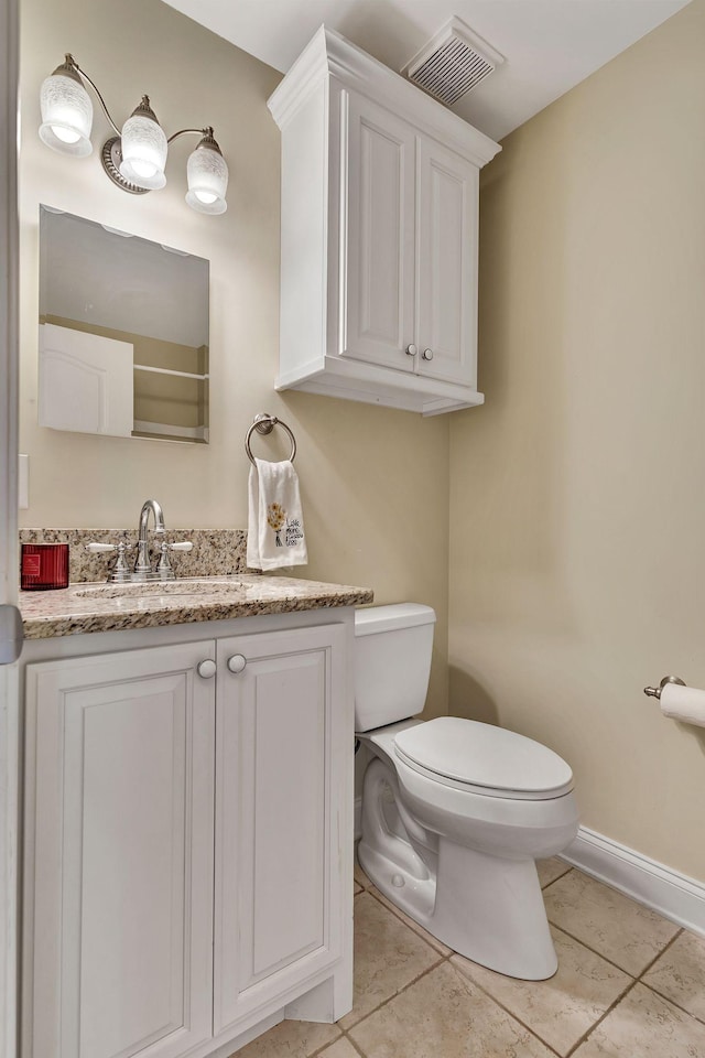1012 Carrs Creek Blvd, Greenbrier, TN 37073 - half bathroom with visible vents, tile patterned flooring, vanity, toilet, and baseboards