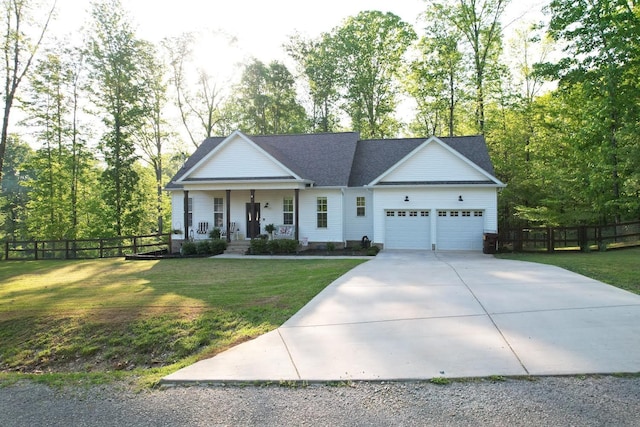 modern inspired farmhouse with covered porch, fence, a front lawn, concrete driveway, and an attached garage