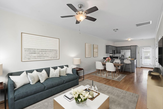 4325 Ashland City Hwy Unit 8, Nashville, TN 37218 - living area with visible vents, a ceiling fan, crown molding, and wood finished floors