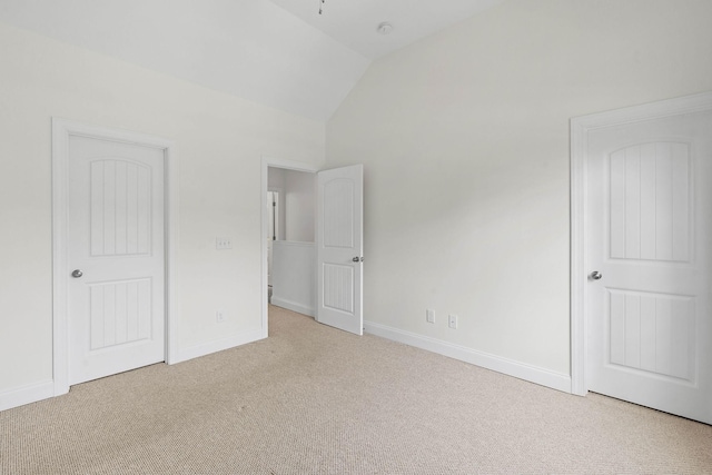 4325 Ashland City Hwy Unit 8, Nashville, TN 37218 - unfurnished bedroom with baseboards, carpet flooring, and lofted ceiling