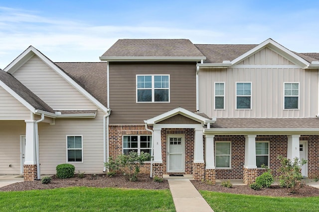4325 Ashland City Hwy Unit 8, Nashville, TN 37218 - craftsman-style home featuring brick siding, a shingled roof, and board and batten siding