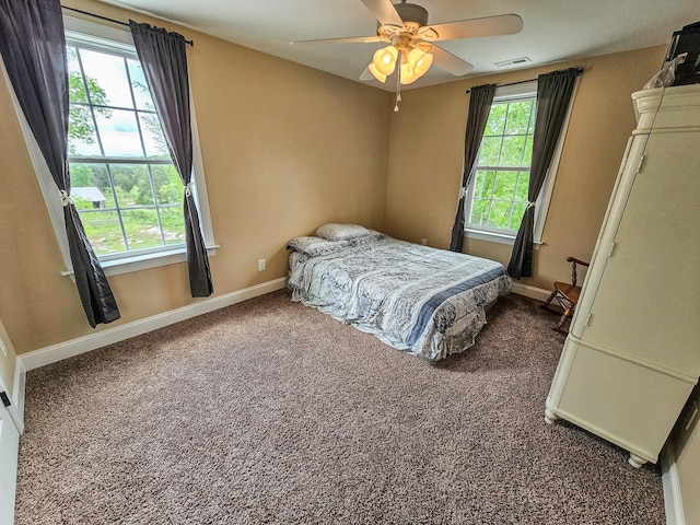 2971 Ownby Rd, Lewisburg, TN 37091 - bedroom with visible vents, baseboards, dark carpet, and ceiling fan