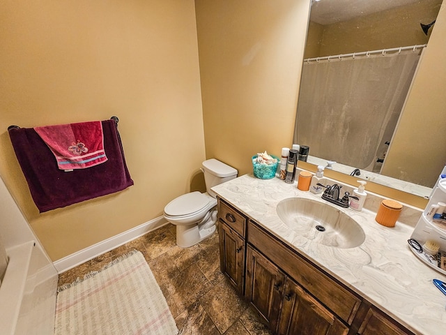 2971 Ownby Rd, Lewisburg, TN 37091 - full bath featuring vanity, toilet, baseboards, stone finish floor, and a shower with curtain