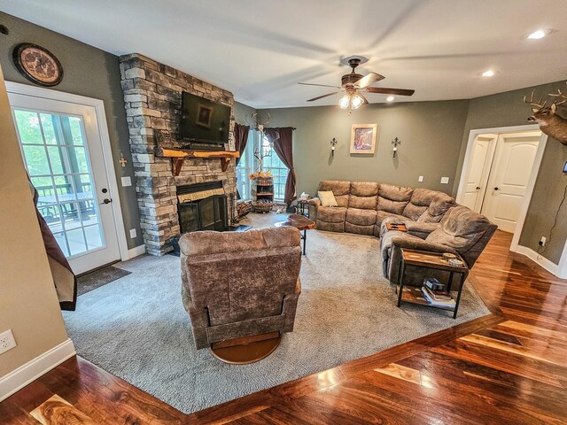 2971 Ownby Rd, Lewisburg, TN 37091 - living room featuring baseboards, plenty of natural light, a fireplace, and a ceiling fan