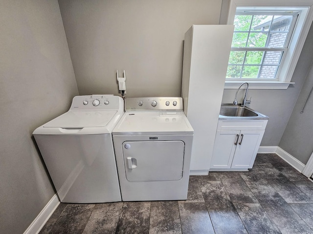 2971 Ownby Rd, Lewisburg, TN 37091 - laundry area featuring separate washer and dryer, a sink, cabinet space, and baseboards