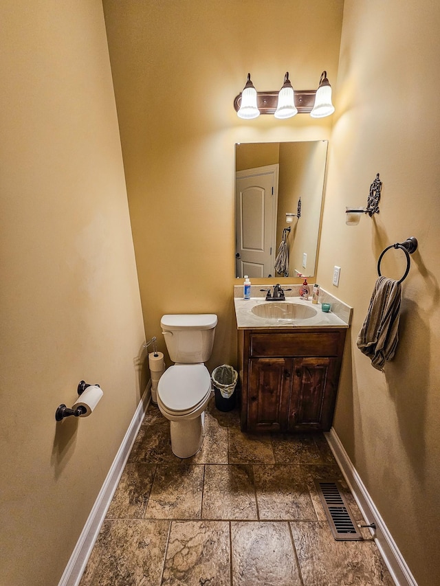 2971 Ownby Rd, Lewisburg, TN 37091 - half bathroom featuring visible vents, baseboards, vanity, toilet, and stone tile floors