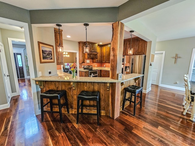 2971 Ownby Rd, Lewisburg, TN 37091 - bar with appliances with stainless steel finishes, baseboards, dark wood-style flooring, and decorative light fixtures