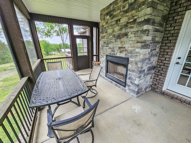 2971 Ownby Rd, Lewisburg, TN 37091 - sunroom with outdoor dining area and a fireplace