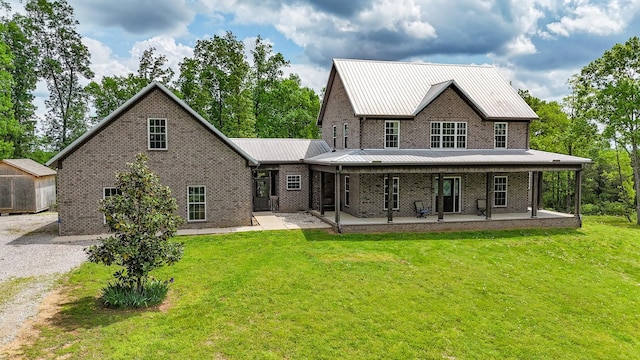 2971 Ownby Rd, Lewisburg, TN 37091 - back of property with a yard, metal roof, and brick siding