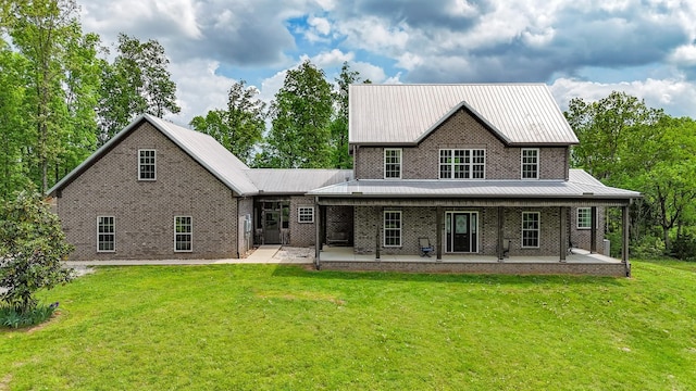 2971 Ownby Rd, Lewisburg, TN 37091 - back of house with a lawn, metal roof, and brick siding