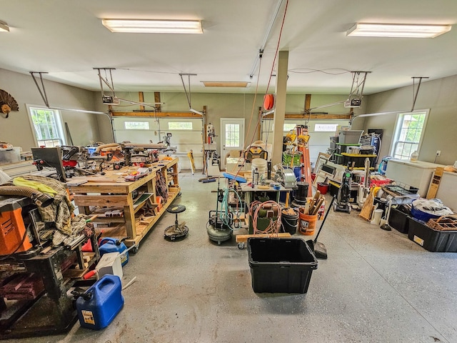 2971 Ownby Rd, Lewisburg, TN 37091 - garage with a workshop area and a garage door opener