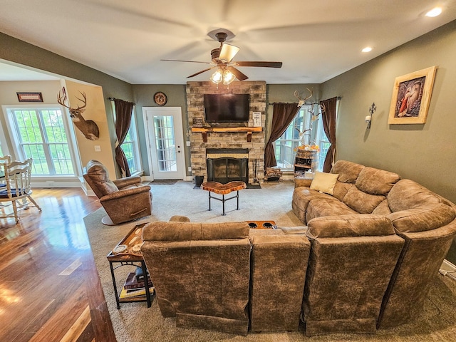 2971 Ownby Rd, Lewisburg, TN 37091 - living room featuring a ceiling fan, recessed lighting, a stone fireplace, and wood finished floors