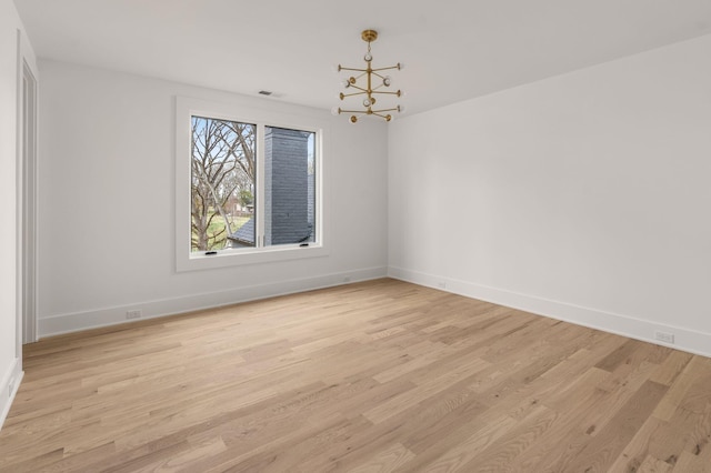6120 Bresslyn Rd, Nashville, TN 37205 - empty room featuring light wood-type flooring and a chandelier