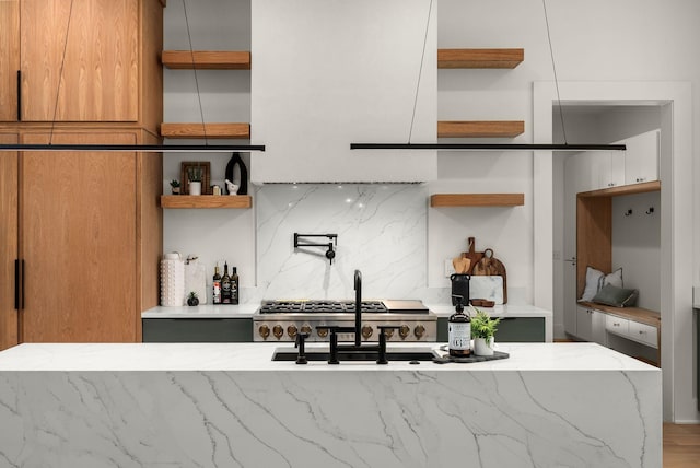 6120 Bresslyn Rd, Nashville, TN 37205 - kitchen with open shelves, light stone counters, backsplash, and brown cabinetry