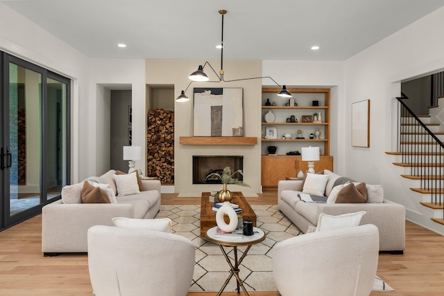 6120 Bresslyn Rd, Nashville, TN 37205 - living room featuring light wood finished floors, stairway, and recessed lighting