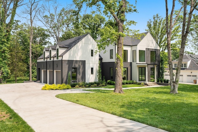 6120 Bresslyn Rd, Nashville, TN 37205 - view of front of home with a front lawn, driveway, a garage, and stucco siding