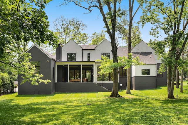 6120 Bresslyn Rd, Nashville, TN 37205 - back of house with a sunroom, a yard, a shingled roof, and a chimney
